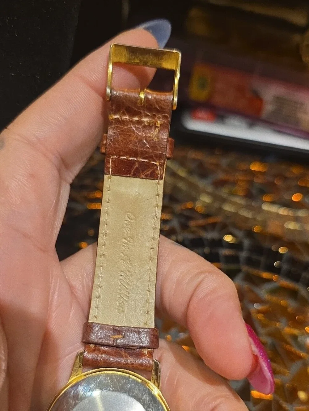 Vintage Gold-Tone Watch with Brown Leather Strap and Yellow Dial